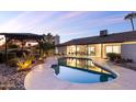 Backyard with a sparkling pool, gazebo, and covered patio perfect for outdoor entertaining at 12271 N 74Th St, Scottsdale, AZ 85260