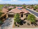 Bird's eye view of home with tile roof, desert landscaping, and convenient driveway at 12904 W Dale Ln, Peoria, AZ 85383