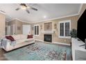 Inviting living room with fireplace, wood floors, neutral walls and stylish decor at 16365 N 138Th Ave, Surprise, AZ 85374