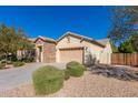 Attractive single-Gathering home featuring a two-car garage and desert landscaping for low maintenance at 16758 W Apache St, Goodyear, AZ 85338