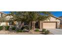 Charming single-Gathering home with desert landscaping, stone accents, and a two-car garage at 16758 W Apache St, Goodyear, AZ 85338