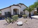 Inviting single-story home with desert landscaping and a covered entryway at 1679 E Oakland St, Gilbert, AZ 85295