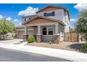 Charming two-story home boasts a well-maintained yard and inviting front porch with stone accents at 2741 S Gordon --, Mesa, AZ 85209