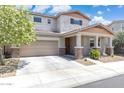 Charming two-story home boasts a well-maintained yard and inviting front porch with stone accents at 2741 S Gordon --, Mesa, AZ 85209