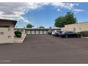 Exterior view of a convenient parking area with multiple vehicles parked in an orderly fashion at 440 S Parkcrest -- # 22, Mesa, AZ 85206