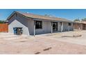 Side view of a single story home with blue recycling and trash bins at 4441 N 27Th Dr, Phoenix, AZ 85017