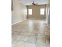 Bright and spacious living room with a ceiling fan and tiled floors at 5345 W Marcus Dr, Phoenix, AZ 85083