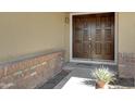 Close-up showcasing the property's ornate front door and brick entryway at 6128 W Columbine Dr, Glendale, AZ 85304