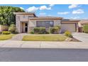 Charming single-story home featuring desert landscaping, stone accents, and a two-car garage at 6886 W Mazatzal Dr, Peoria, AZ 85383