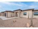 Charming home featuring desert landscaping with gravel, cacti, and natural stone accents at 9626 E Bunny Ear E Ln, Gold Canyon, AZ 85118