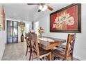 Inviting dining room featuring a wooden table with seating for six and decorative accents for a warm and welcoming atmosphere at 1018 S Toltec --, Mesa, AZ 85204