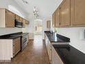 Bright kitchen featuring stainless steel appliances and tile flooring, ideal for modern cooking at 14235 W Shawnee Trl, Surprise, AZ 85374