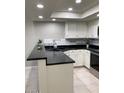 Modern kitchen with breakfast bar and ample counter space at 1432 W Emerald Ave # 51, Mesa, AZ 85202