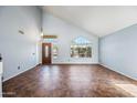 An open concept living room featuring high ceilings and large windows for ample natural light at 1638 N Avoca --, Mesa, AZ 85207