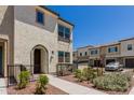 Inviting exterior view showcases desert landscaping and a charming private patio at 1849 E Chelsea Ln # 107, Gilbert, AZ 85295