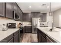Beautiful kitchen with stainless appliances, quartz countertops, and stylish cabinets at 1849 E Chelsea Ln # 107, Gilbert, AZ 85295