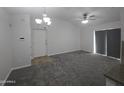 Neutral open floor plan features updated lighting and ceiling fan with convenient access to front entry door at 200 E Southern Ave # 363, Tempe, AZ 85282