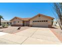 Charming single-story home featuring a terracotta roof, neutral stucco, and a well-maintained driveway at 2005 Leisure World --, Mesa, AZ 85206