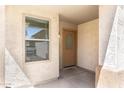 Warm and welcoming front porch with a decorative door and shade from the Arizona sun at 2174 W Kristina Ave, San Tan Valley, AZ 85144