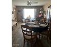 Inviting dining room featuring a classic table setting and lots of light at 2501 E Pebble Beach Dr, Tempe, AZ 85282
