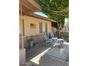 Relax on the covered front porch with comfortable seating and charming decor at 2501 E Pebble Beach Dr, Tempe, AZ 85282