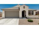 Beautiful single-story home with desert landscaping, concrete driveway, and an arched entryway at 25915 W Tina Ln, Buckeye, AZ 85396