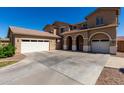 Spacious stucco home featuring a multi-car garage and ample parking space at 3065 E Harvard Ave, Gilbert, AZ 85234