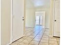 Bright living area featuring tiled floors with an open doorway and lots of natural light at 3121 W Laurie Ln, Phoenix, AZ 85051