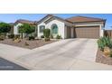 Spacious home with a tile roof and desert landscaping and a two car garage and large driveway at 31320 N 54Th Pl, Cave Creek, AZ 85331