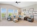 Inviting living room features large windows, neutral paint and comfortable seating at 31320 N 54Th Pl, Cave Creek, AZ 85331