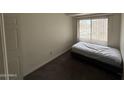 Bedroom with a large window at 4111 W Reade Ave, Phoenix, AZ 85019