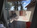 This charming outdoor patio includes a secure surrounding fence at 4111 W Reade Ave, Phoenix, AZ 85019