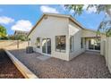 The back of the home features a low maintenance rock yard and a covered patio, perfect for outdoor living at 4725 E Brown Rd # 13, Mesa, AZ 85205