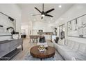 Bright, open-concept living room and kitchen with modern finishes, stylish furnishings, and ample natural light at 4725 E Brown Rd # 13, Mesa, AZ 85205