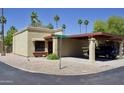 Charming single-story home with a covered carport, xeriscaping, and a quaint neighborhood street view with blue skies at 520 S Sand Verbena Way, Mesa, AZ 85208