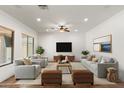 Bright living room featuring modern furnishings, wood floors, and neutral decor at 5650 E Ocupado Dr, Cave Creek, AZ 85331