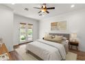 Serene bedroom with French doors to pool, soft colors, and ample natural light at 5650 E Ocupado Dr, Cave Creek, AZ 85331