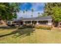 Beautiful single-Gathering home with well-kept lawn and classic architecture at 6525 N 3Rd St, Phoenix, AZ 85012