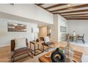 Bright living room featuring exposed wood beam ceilings and contemporary furnishings at 6525 N 3Rd St, Phoenix, AZ 85012