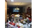 View of a cluttered living room with furniture and personal belongings at 730 N Karen Dr, Chandler, AZ 85224