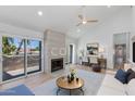 Bright living room with fireplace, vaulted ceilings, and an adjacent work nook, flooded with natural light at 7810 E Via Camello -- # 72, Scottsdale, AZ 85258