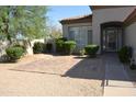 Inviting front yard showcasing desert landscaping, gravel, and a walkway to the front door at 7979 E Princess Dr # 8, Scottsdale, AZ 85255