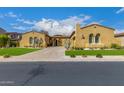 Stucco home with tile roof, beautiful archways, desert landscaping, and a well-maintained front lawn at 8298 E Tailfeather Dr, Scottsdale, AZ 85255