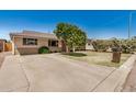 Attractive ranch-style home featuring lush front yard landscaping and a long driveway at 844 E Ruth Ave, Phoenix, AZ 85020