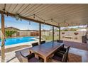 Inviting outdoor patio with a swimming pool and mountain views, perfect for entertaining at 844 E Ruth Ave, Phoenix, AZ 85020