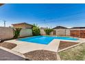 Refreshing backyard pool surrounded by lush greenery offers a private oasis at 844 E Ruth Ave, Phoenix, AZ 85020