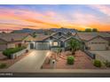 Charming single-Gathering home with desert landscaping, a well-maintained lawn, and mountain views at 8776 E Brilliant Sky Cir, Gold Canyon, AZ 85118
