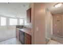 Cozy kitchen with essential appliances and a view into the open floor plan at 9820 N Central Ave # 212, Phoenix, AZ 85020