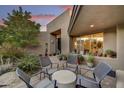 Private outdoor patio with seating and views of the surrounding desert landscape at 10638 E Honey Mesquite Dr, Scottsdale, AZ 85262
