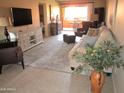 Bright living room with a large window, comfortable seating, and modern decor at 12222 N Paradise Village S Pkwy # 325, Phoenix, AZ 85032